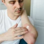 Skin with hives showing red, raised welts caused by an allergic reaction