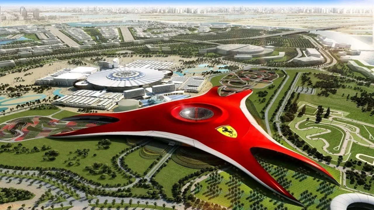 Aerial photo of Ferrari World Abu Dhabi with its iconic red roof and surrounding attractions.