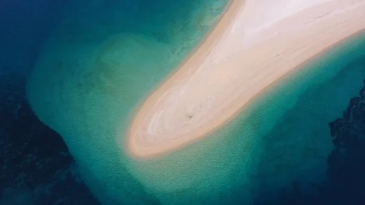 Aerial view of a stunning sandy beach with turquoise water on the Croatian coast, perfect example of Croatia’s most beautiful and unique beaches.