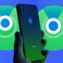 Person holding an iPhone with the Find My app background, symbolizing iPhone tracking and location services even when the device is turned off.
