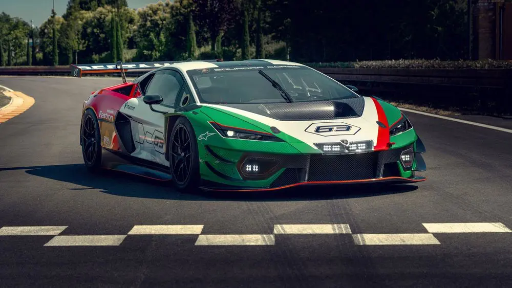 Lamborghini Temerario GT3 on a racetrack crossing the finish line, featuring Italian tricolor livery and aggressive front aerodynamics.