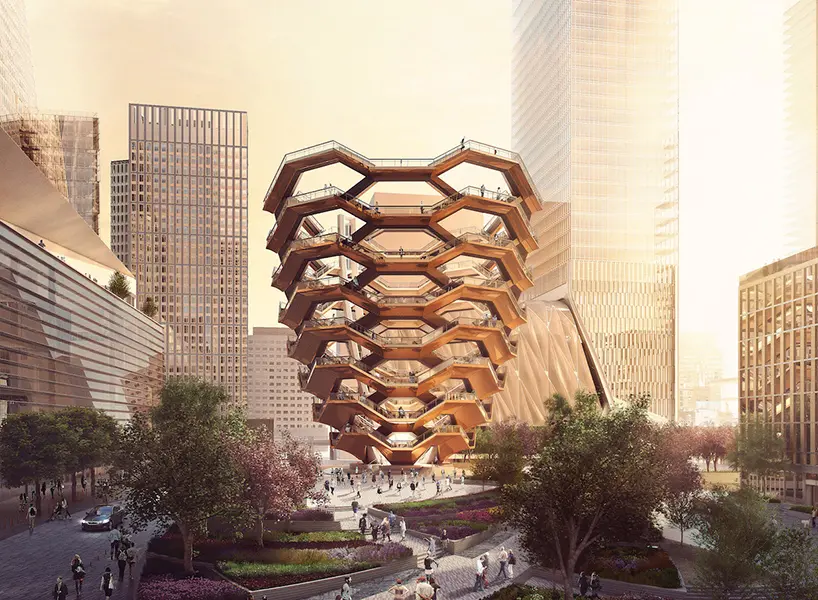Architectural structure of The Vessel in Hudson Yards, New York City, with honeycomb-shaped staircases and modern skyscrapers around.