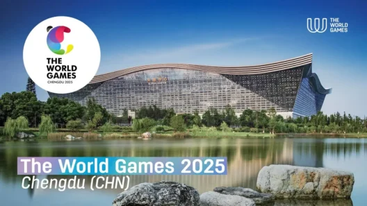 A panoramic view of the Global Center in Chengdu, China, with The World Games 2025 logo and text, surrounded by greenery and a tranquil lake in the foreground.