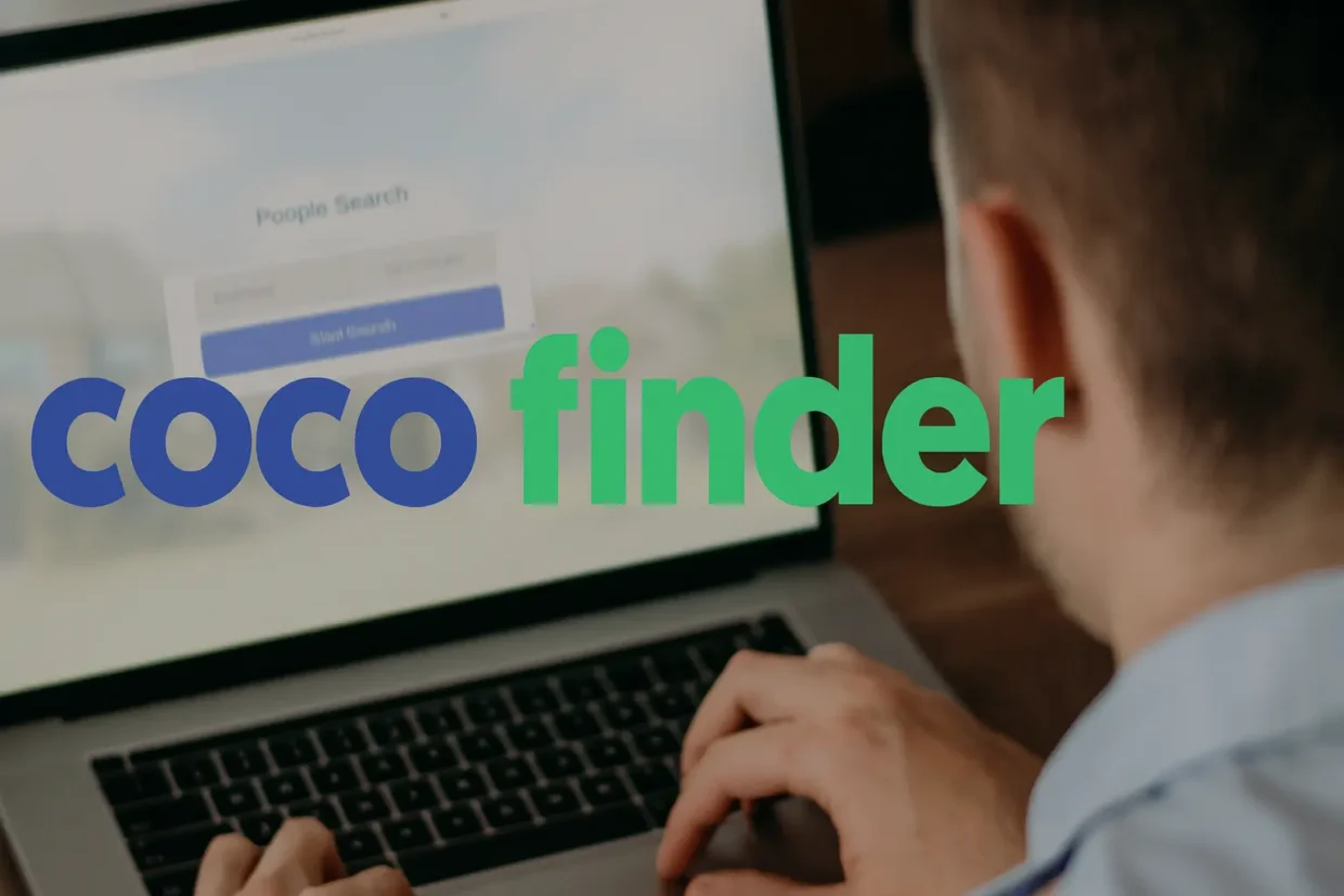 A man is using a laptop with the CocoFinder website on the screen. The CocoFinder logo is large and clear in the foreground, with nothing touching the image edges. The photo is in a bright, realistic style and 16:9 format.