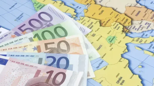 Euro banknotes on a map of Europe – illustrating salary differences and employment costs across European countries.