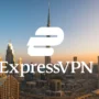 ExpressVPN logo centered over the Dubai skyline with Burj Khalifa, illustrating practical VPN use for unblocking streaming, making secure calls, and protecting privacy on hotel and public Wi-Fi networks in Dubai.