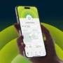 Hand holding a smartphone displaying the ExpressVPN mobile app connected to a Chicago, USA server, with a green power button and a modern interface for selecting VPN locations.