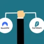 Illustration of a hand holding a balance bar with the NordVPN and Surfshark logos on each side, symbolizing a comparison between the two VPN services.