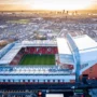 Aerial view of Anfield Stadium in Liverpool at sunset, showcasing the legendary home of Liverpool FC surrounded by the city – a must-visit destination for every football fan.