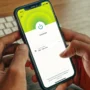 User connected to ExpressVPN on a smartphone, illustrating easy access to VPN protection across all pricing plans—Basic, Advanced, and Pro.