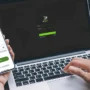 A person logging into IPVanish on both a smartphone and a laptop at the same time, illustrating the real benefit of unlimited device connections for families, small businesses, or anyone who wants VPN security on all their gadgets.