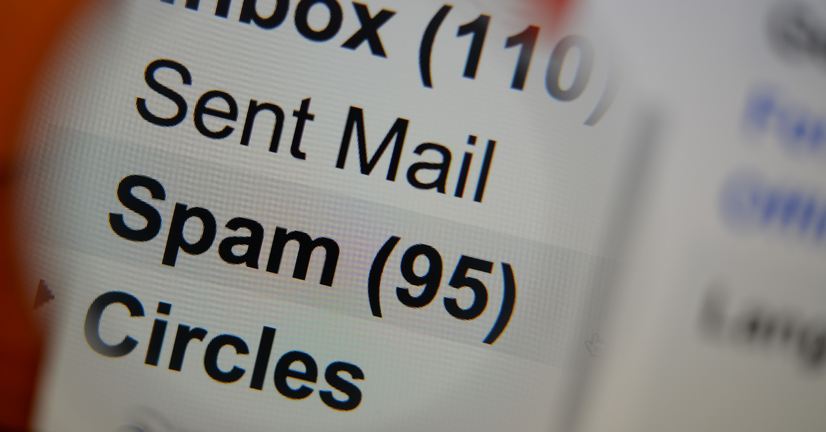 A close-up of a computer screen showing an email inbox with a visible “Spam (95)” folder, highlighting the high number of unwanted messages.