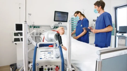 ECMO machine beside an ICU patient receiving life support while doctors monitor vital signs.