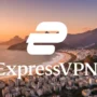 ExpressVPN logo centered over Rio de Janeiro’s coastline at sunset, showing the city skyline, Sugarloaf Mountain, and Christ the Redeemer in the background.