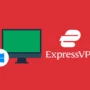 A desktop PC setup with a wide monitor shows a green ExpressVPN interface, placed next to the official ExpressVPN logo on a red background. The Windows logo sits in front, making it clear this setup is made for Windows users.