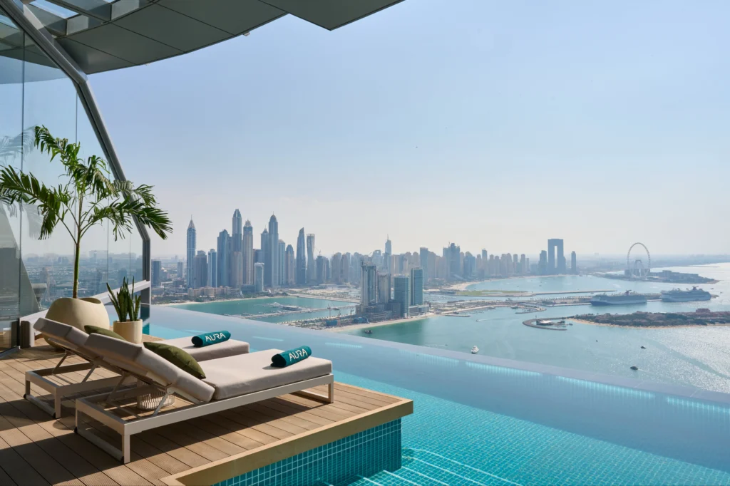 Infinity pool with a killer view of Dubai Marina skyline and the Gulf—ultimate luxury lounging in the sky.
