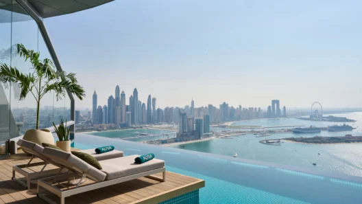 Infinity pool with a killer view of Dubai Marina skyline and the Gulf—ultimate luxury lounging in the sky.