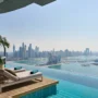 Infinity pool with a killer view of Dubai Marina skyline and the Gulf—ultimate luxury lounging in the sky.