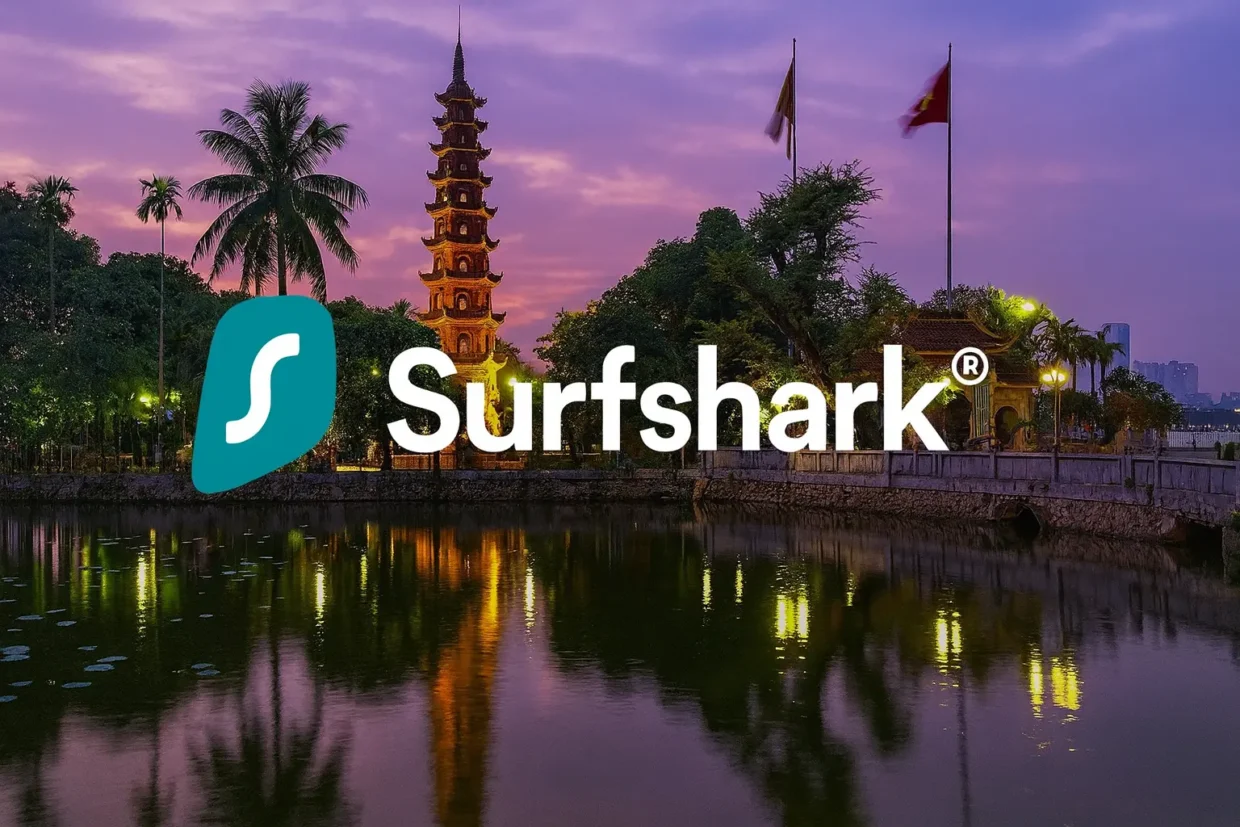 Surfshark logo centered over a panoramic view of Hanoi, Vietnam, showing city skyline, lake, and local architecture in the evening light.