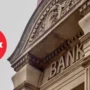 Historic stone bank building with the word "BANK" on the facade and the Turkish flag symbol overlayed, representing Turkish financial institutions.