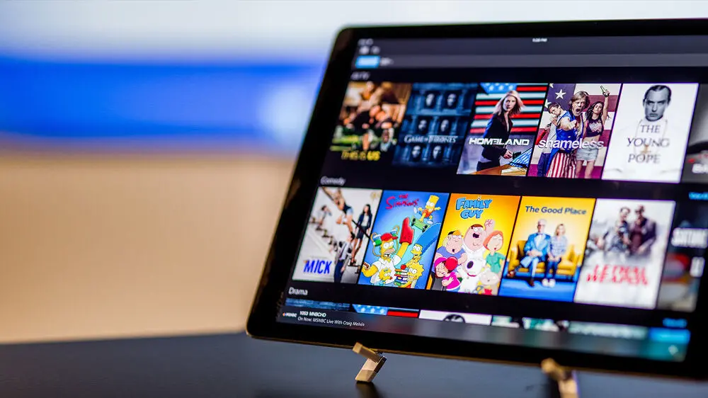 Tablet screen showing Xfinity Stream app with popular US shows available