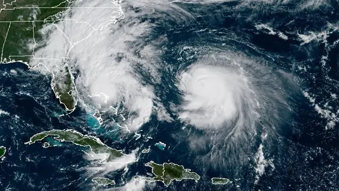 Satellite image showing a powerful hurricane approaching Florida from the Atlantic Ocean during peak storm season.