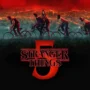 The official Stranger Things 5 red logo glowing over Hawkins.