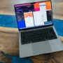 Real VPN testing setup with ProtonVPN, ExpressVPN, NordVPN, and Surfshark open on a MacBook.