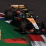 McLaren Formula 1 car pushing hard over kerbs during the São Paulo Grand Prix weekend