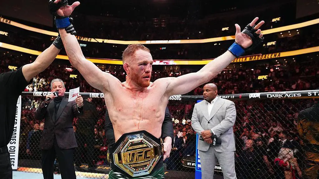 Jack Della Maddalena | Venclikovi.com Jack Della Maddalena celebrates his UFC welterweight title victory, arms raised inside the Octagon