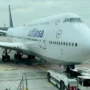 Lufthansa Boeing at the gate in Frankfurt before our long flight to Orlando the exact route where the VPN trick saved us serious money