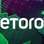 eToro logo over digital trading background with stock charts and world map