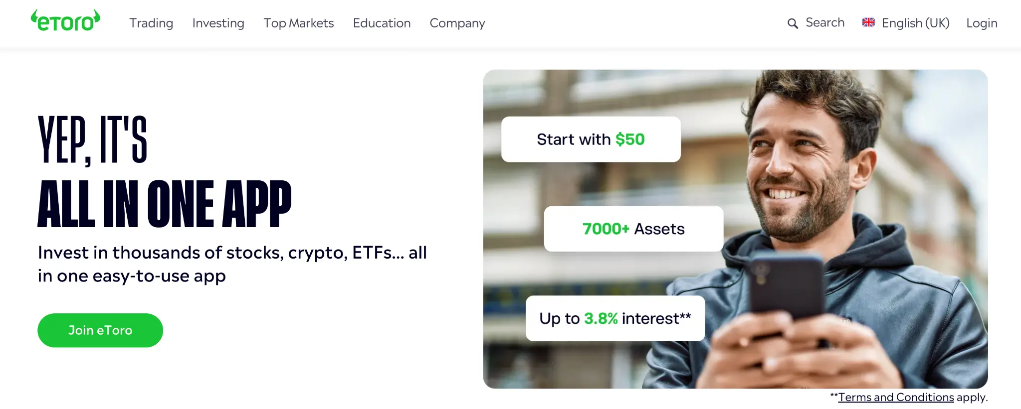 etoro-app-interface-bonus-offer | Venclikovi.com Smiling man using the eToro app to manage investments from his phone