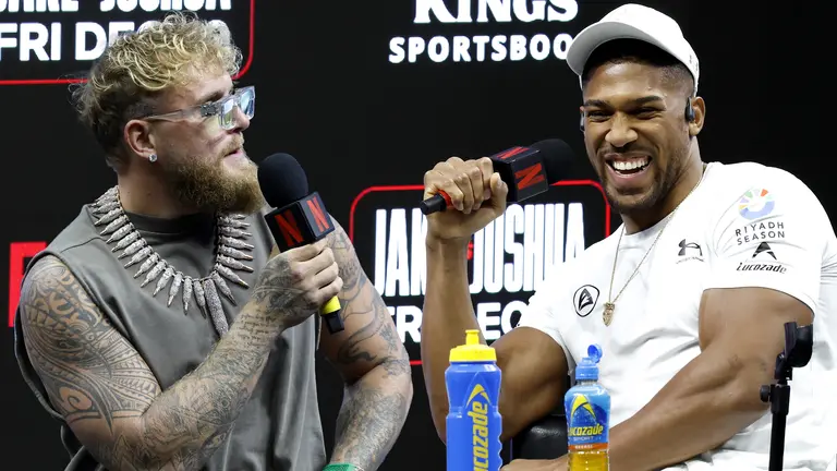 Jake Paul vs Anthony Joshua 2 | Venclikovi.com Jake Paul and Anthony Joshua laughing during the official press conference ahead of the Judgment Day fight in Miami, streamed live on Netflix.