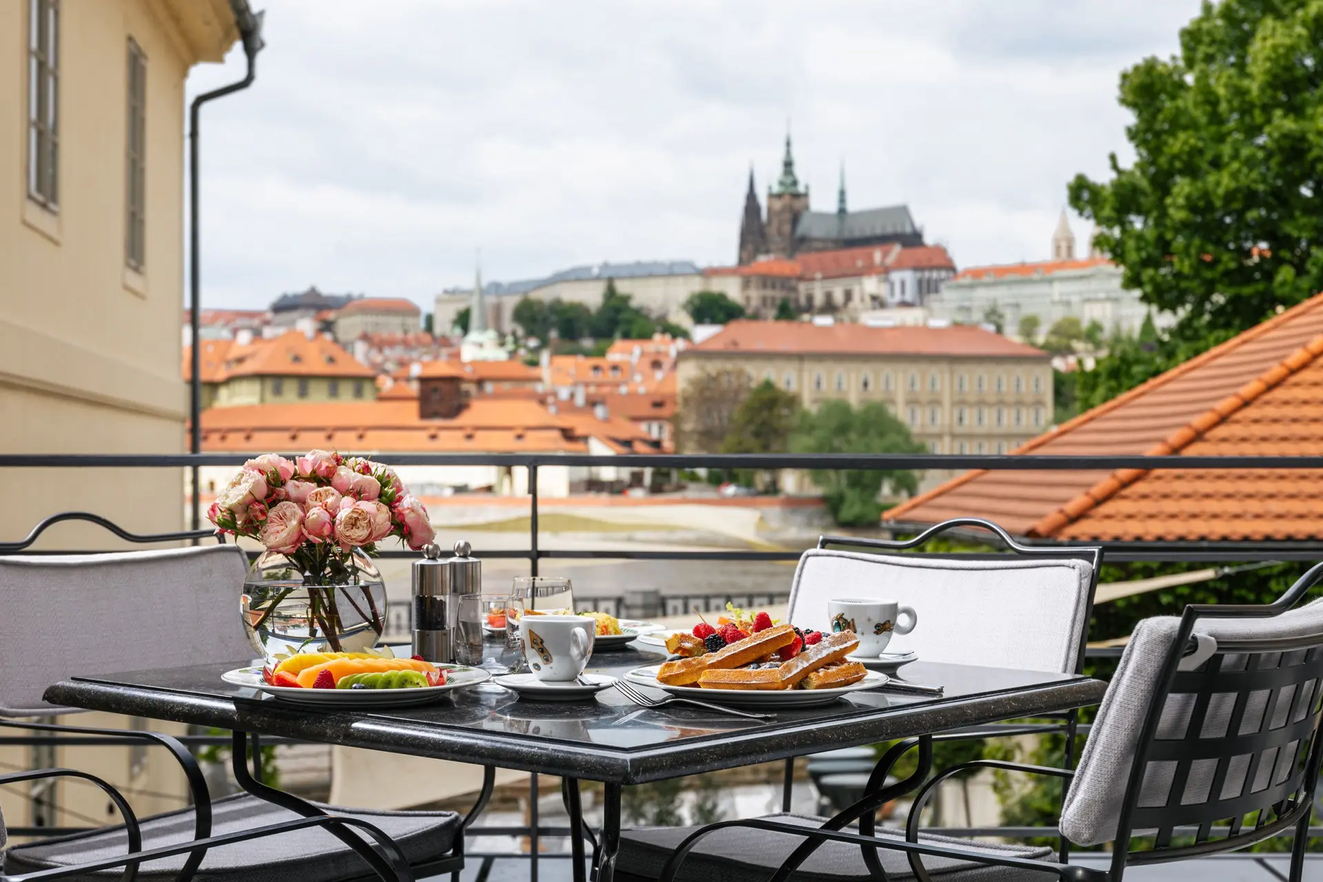 Four Seasons Hotel Prague | Venclikovi.com Private terrace breakfast at Four Seasons Hotel Prague with views over red rooftops and Prague Castle