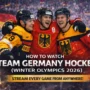 Three German ice hockey players celebrate on the rink in front of cheering fans, wearing national team jerseys during the 2026 Winter Olympics.