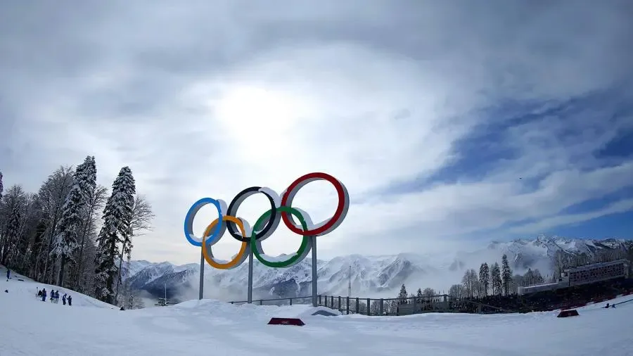 olympics-rings-mountains | Venclikovi.com Olympic rings standing in snowy mountains during the Winter Olympics with alpine scenery in the background