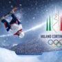 Olympic snowboarder performing a high aerial trick in the halfpipe at Milano Cortina 2026 Winter Olympics