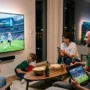 Family watching FIFA World Cup 2026 Mexico vs Argentina live stream on TV, phone and tablet at home